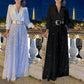 Eleganter Jumpsuit mit V-Ausschnitt, langen Ärmeln, weitem Bein und Paillettenbesatz