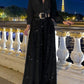 Eleganter Jumpsuit mit V-Ausschnitt, langen Ärmeln, weitem Bein und Paillettenbesatz
