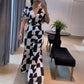 Damen Jumpsuit mit V-Ausschnitt, weitem Bein und geometrischem Druck