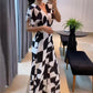 Damen Jumpsuit mit V-Ausschnitt, weitem Bein und geometrischem Druck