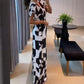 Damen Jumpsuit mit V-Ausschnitt, weitem Bein und geometrischem Druck