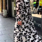 Damen elegantes Kleid mit abstraktem Muster und fließendem Schnitt