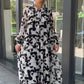 Damen elegantes Kleid mit abstraktem Muster und fließendem Schnitt