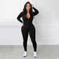 Einfarbiger nahtloser Jumpsuit mit halbem Reißverschluss