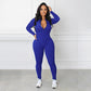 Einfarbiger nahtloser Jumpsuit mit halbem Reißverschluss