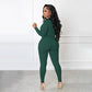 Einfarbiger nahtloser Jumpsuit mit halbem Reißverschluss