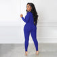 Einfarbiger nahtloser Jumpsuit mit halbem Reißverschluss