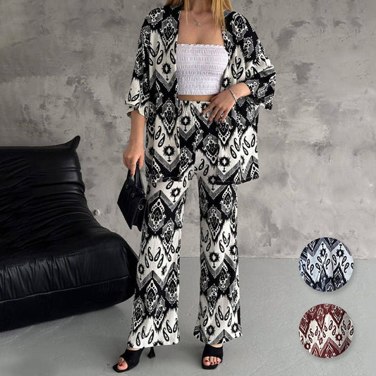 Zweiteiliges Set aus bedruckter Strickjacke mit halblangen Ärmeln und trendiger Hose mit weitem Bein