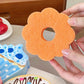 Reinigungsschwamm in Dessertform für die Küche