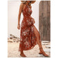 Elegantes Neckholder-Kleid mit Blumenmuster und Beinschlitz